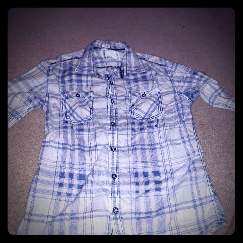 Buckle button down collared shirt.